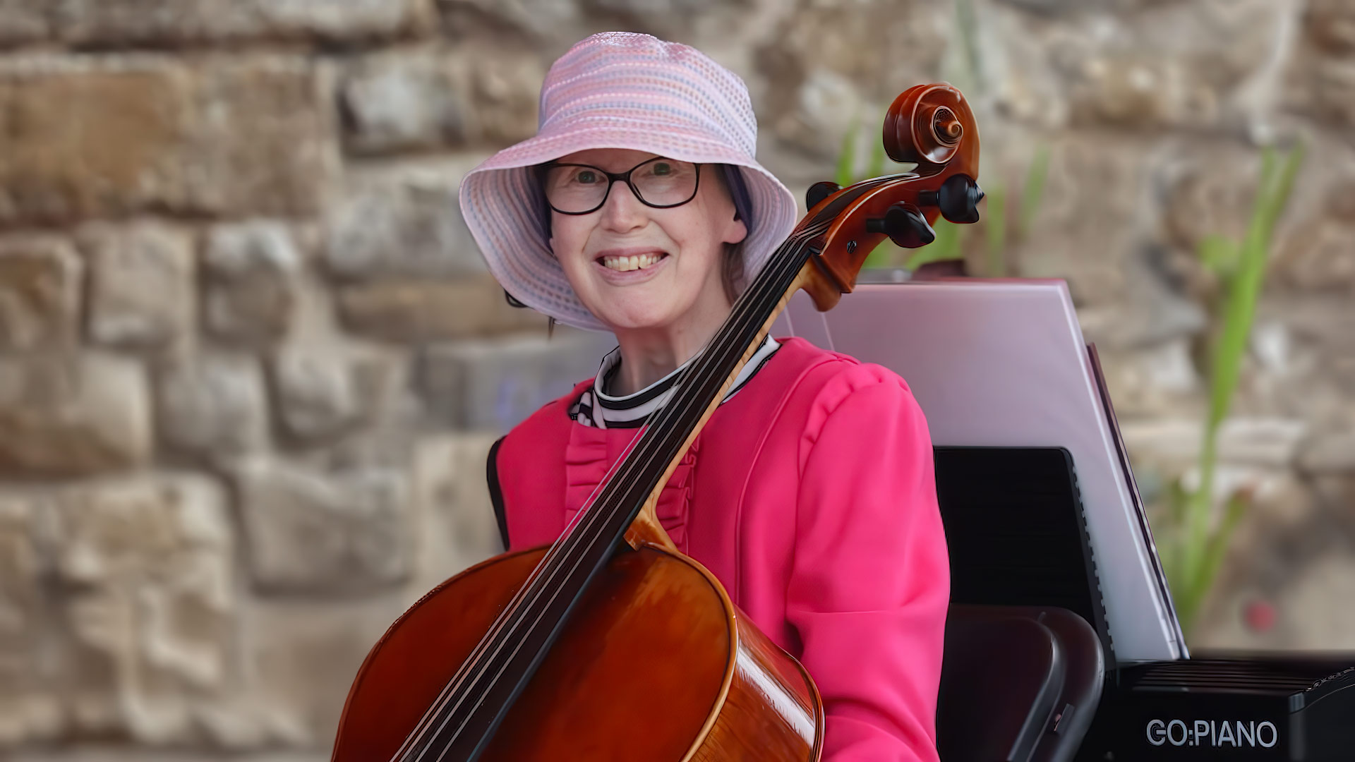 Portrait of Monica Baker with her cello